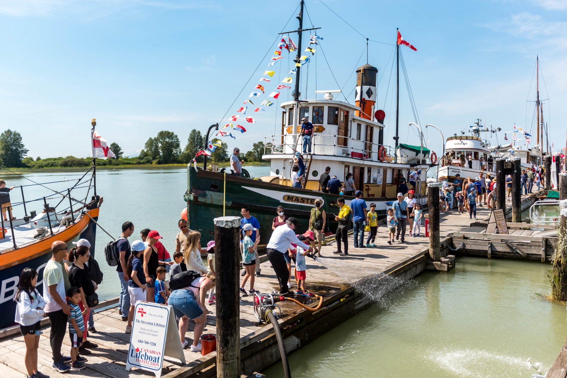 Visitors on dock at Britannia Shipyards National Historic Site during the Richmond Maritime Festival