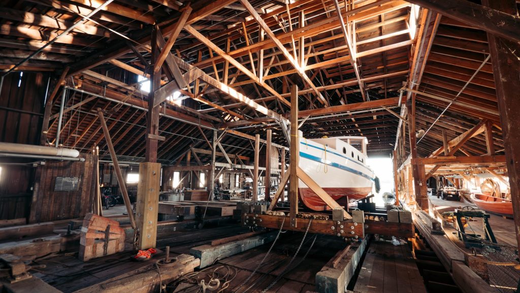 MV Burnaby wooden boat hauled into historic wooden building