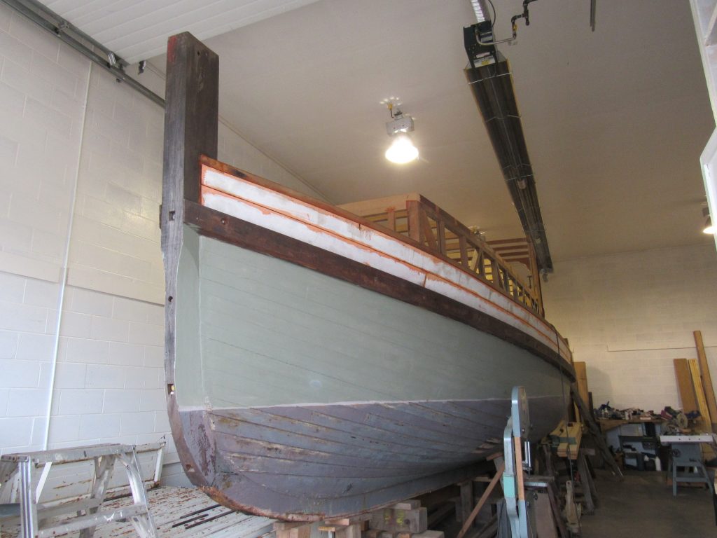 MV Burnaby wooden tugboat in workshop undergoing restoration