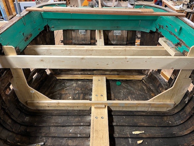 Cockpit area of restored boat using new and old wood