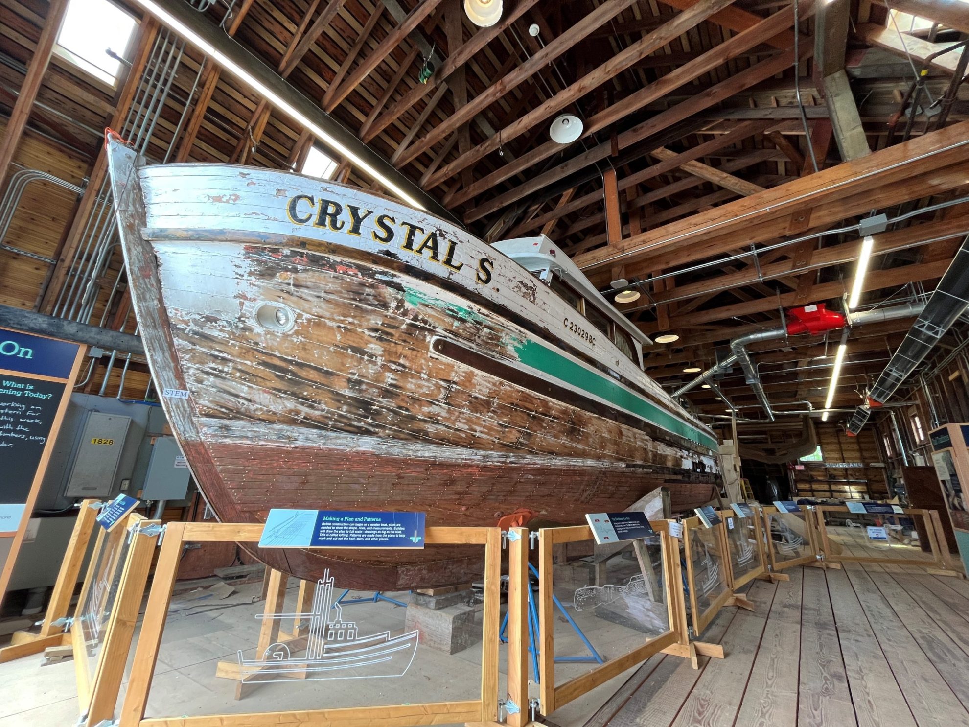 Wooden gillnetter boat on a frame stand on display inside the Richmond Boat Builders