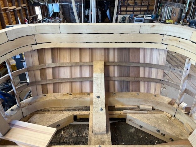 Inside view of the wooden planks arranged in bent formation around the Crystal S boat