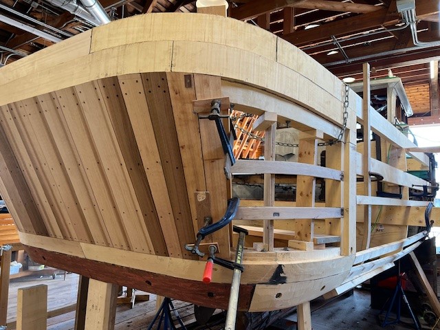 Wooden planks arranged in bent formation around the Crystal S boat