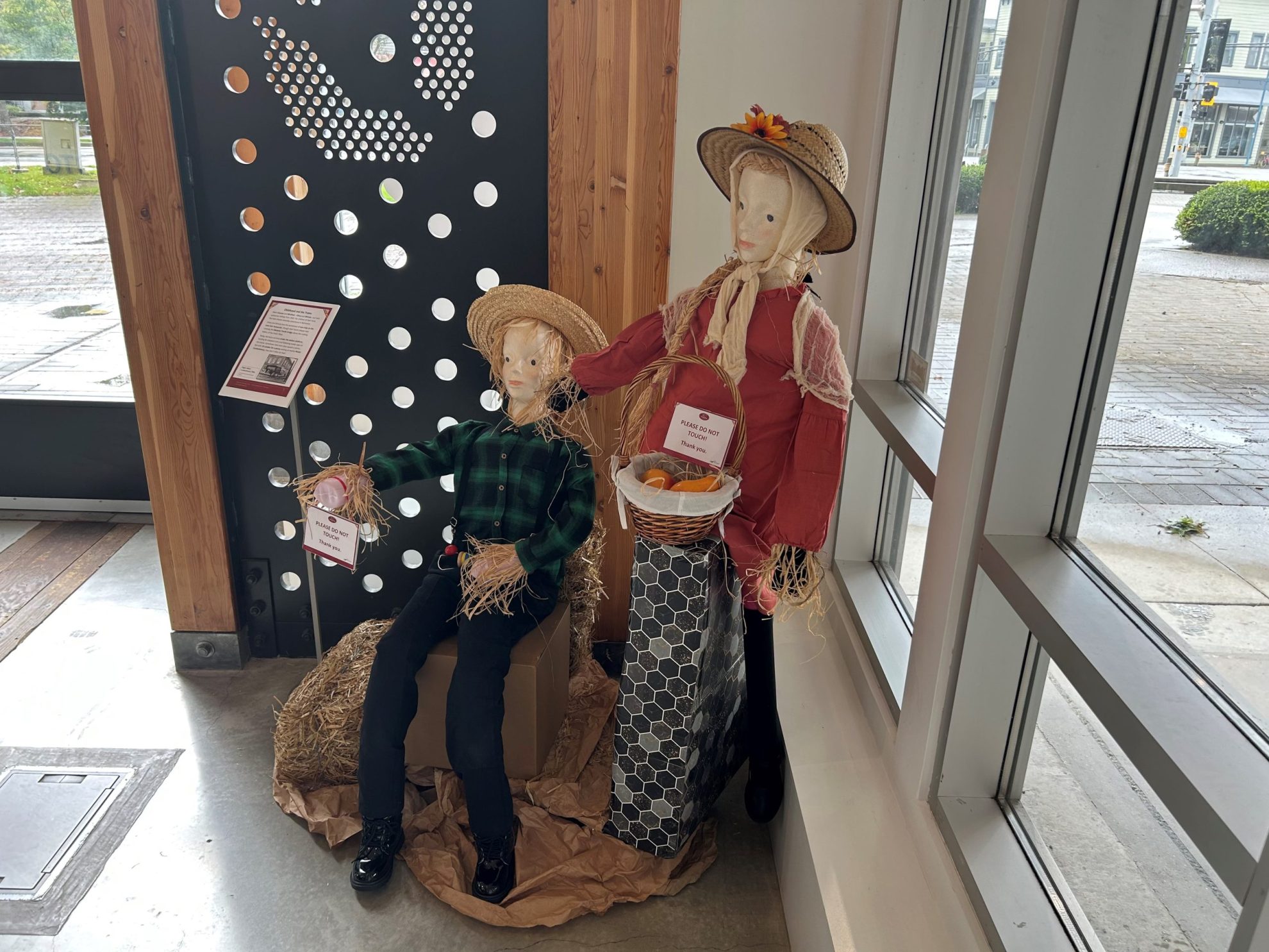 Two scarecrows modelled as children from 1930s