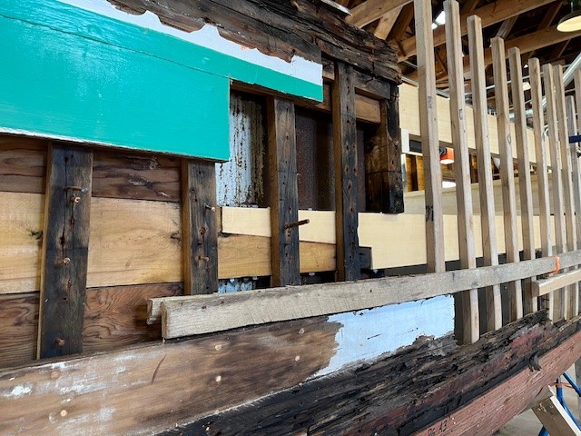 Exterior view of old and new hull portion of Crystal S restoration project