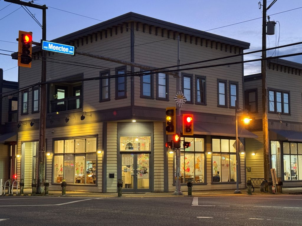 evening photo of a street corner cafe
