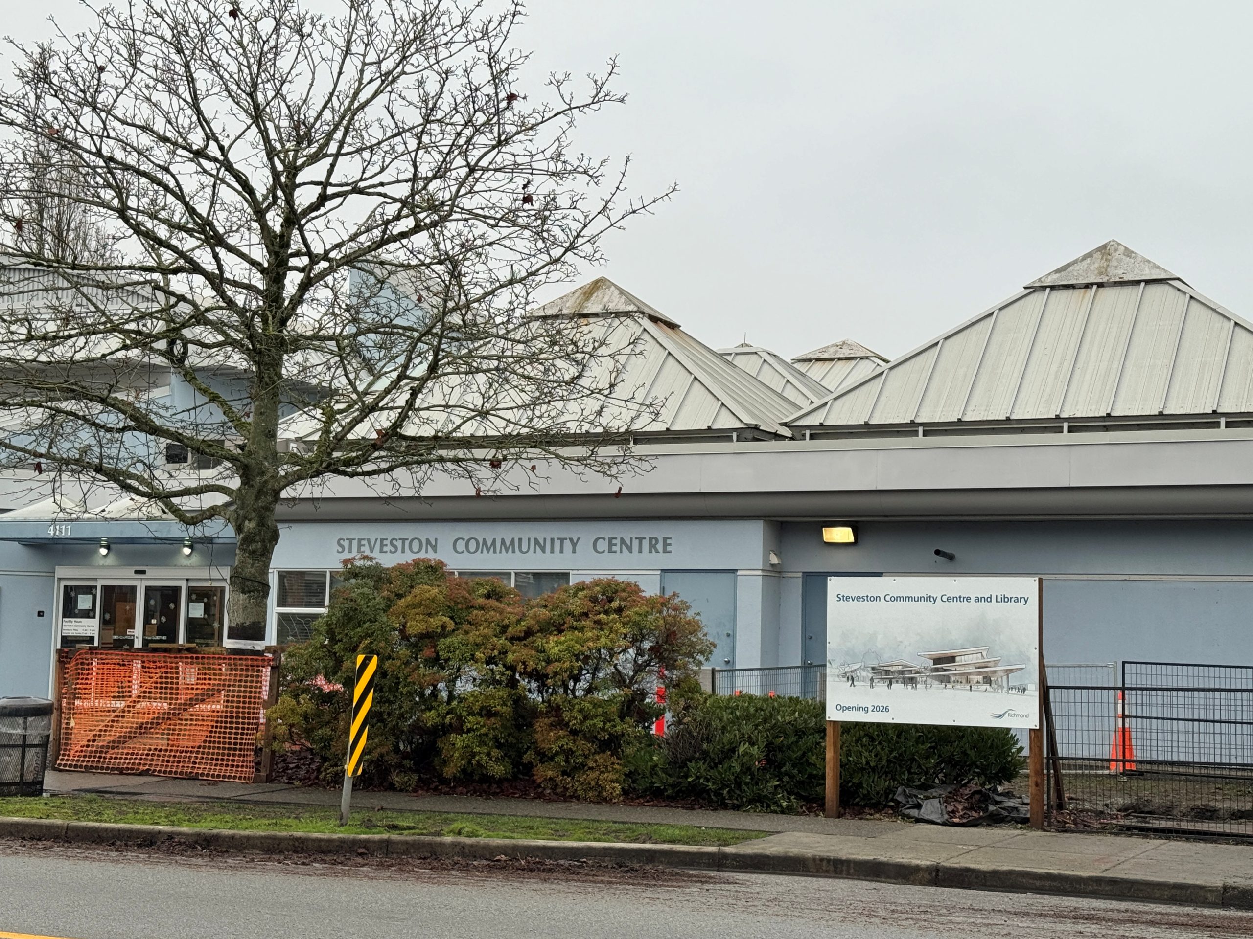 Exterior photo of Steveston Community Centre with sign of new project