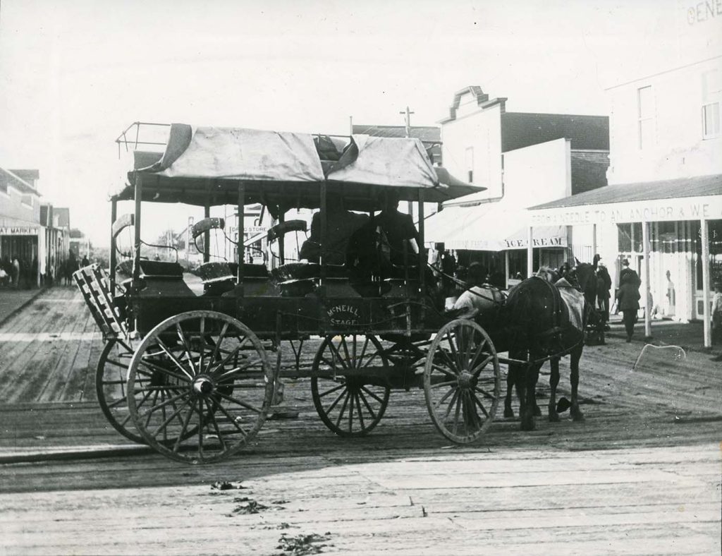 black and white photo of horse and buggy
