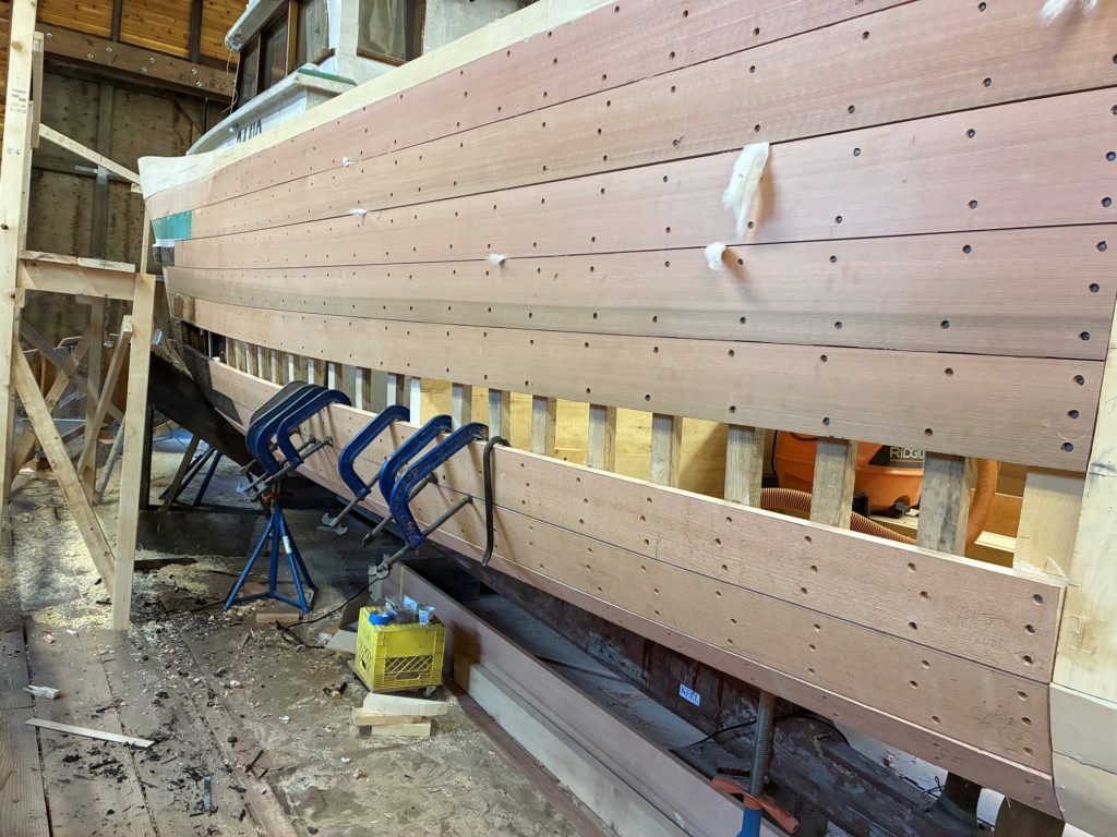 side view of wooden boat construction